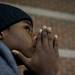 Customer T'ontaye Jones, 14, waits in line for Black Friday deals outside Best Buy late Wednesday night. He was there to get a 40 inch television. Daniel Brenner I AnnArbor.com